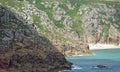 Immense rocks surrounding Porthcurno beach Royalty Free Stock Photo
