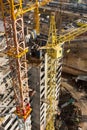 Immense tower cranes at construction site