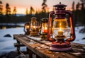 Lantern with burning candles on a wooden pier in the forest