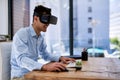 Immersed in a virtual world. a happy young businessman wearing a virtual reality headset while working at his desk in Royalty Free Stock Photo