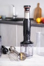 Immersion hand blender on table on a kitchen background, vertically Royalty Free Stock Photo