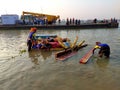 After immersion of idols in the holy river ganges , corporation workers manually collecting hard structures to reduce pollution. Royalty Free Stock Photo