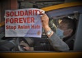 Immigrant Taxi Driver Holding `Stop Asian Hate` Sign NYC