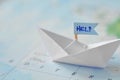 Immigration and ask for asylum concept - paper boat on a map Royalty Free Stock Photo