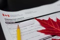 Immigration Canada application form with maple leaf