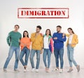 Immigration concept. Group of people standing near light wall