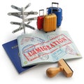 Immigration concept. Passport with stamps and visas, luggage and Royalty Free Stock Photo