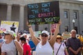 Woman Holds Protest Sign at Immigration Rally