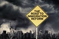 Immigration Reform word with signpost under storm Royalty Free Stock Photo