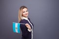 Immigration and the study of foreign languages, concept. A young smiling woman with a Argentina flag in her hand.