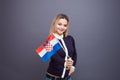 Immigration and the study of foreign languages, concept. A young smiling woman with a Croatia flag in her hand. Royalty Free Stock Photo