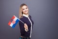 Immigration and the study of foreign languages, concept. A young smiling woman with a Croatia flag in her hand. Royalty Free Stock Photo