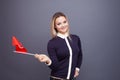 Immigration and the study of foreign languages, concept. A young smiling woman with a Tunisia flag in her hand.