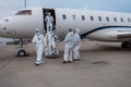 A Immigration team in protective clothing is checking crew and private jet after landing in China