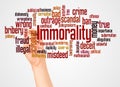 Immorality word cloud and hand with marker concept Royalty Free Stock Photo