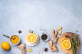 Immune boosting remedy. Flat lay  with ingredients for anti-virus drink from turmeric, thyme, lemon and  star anise on blue Royalty Free Stock Photo