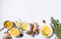 Immune boosting remedy. Flat lay  with ingredients from turmeric, thyme, lemon, star anise and glass water with lemon on white Royalty Free Stock Photo