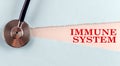 IMMUNE SYSTEM word made on torn paper, medical concept background Royalty Free Stock Photo