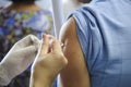 Immunization vaccine injection , doctor inject vaccine to patient arm