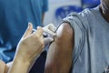 Immunization vaccine injection , doctor inject vaccine to patient arm