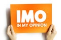 IMO - in my opinion acronym, text concept on card for presentations and reports Royalty Free Stock Photo
