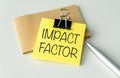 Impact Factor text on paper clipboard with chart and sticky paper on white background Royalty Free Stock Photo