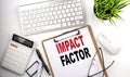 IMPACT FACTOR text on white paper. the inscription on the notebook Royalty Free Stock Photo