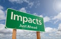 Impacts Just Ahead Green Road Sign Over Clouds and Blue Sky Royalty Free Stock Photo