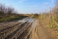 Impassable dirt road. Puddle and dirt on the road