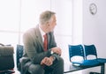 Impatient businessman waiting for a meeting