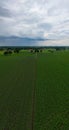 Impending Storm: Aerial View of Fields Under Gathering Clouds