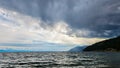 An impending thunderstorm. Clouds over the lake. clouds over the sea. The sun\'s rays break through the clouds over the lake.