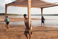 Workers Removing part of the Structures on Cacau Beach use for shade