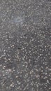 imperfect asphalt road with potholes gravel