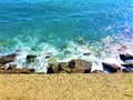 Imperia city, Liguria region, Italy. Sea, water, waves and rocks, nature and peace
