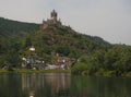 Perched high on the hill over the Moselle River in the picturesque town of Cochem is the beautiful Reichsburg Cochem Castle. Royalty Free Stock Photo