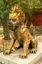 Gilded unicorn sit in the Imperial Garden of the Forbidden City. Beijing Royalty Free Stock Photo