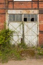 The Imperial Shipyard Trail - high gate of abandoned destroyed hall. Gdansk, Poland