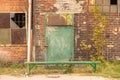 The Imperial Shipyard Trail - high gate of abandoned destroyed hall. Gdansk, Poland