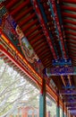 Imperial Summer Palace, Beijing. Traditional Chinese patterns on the ceiling and beams of wooden corridors Royalty Free Stock Photo