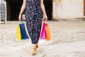 Impersonal photo of a shopping woman with colored bags in her hands