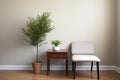 an impersonal therapy room with a plant, minimalist chair, and table