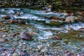 The impetuous waters of a mountain stream Royalty Free Stock Photo