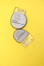 Implantable cardiac defibrillator devices isolated on yellow background. Royalty Free Stock Photo