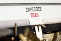 Implicit bias symbol. Concept words Implicit bias typed on white paper on old retro typewriter. Beautiful white background. Royalty Free Stock Photo