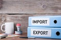 Import and Export. Two binders on desk in the office. Business b Royalty Free Stock Photo