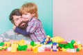 Importance of playing together. Child care concept. Happy family. Child development and upbringing. Father and son have