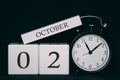 Important date and event on a black and white calendar. Cube date and month, day 2 October. Autumn season