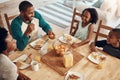 Important meal of the day with the most important people. a family having breakfast together at home.