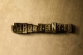 IMPORTANTLY - close-up of grungy vintage typeset word on metal backdrop Royalty Free Stock Photo